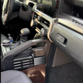 Drop-in center console storage cup installed in a 4th Gen Toyota Tacoma