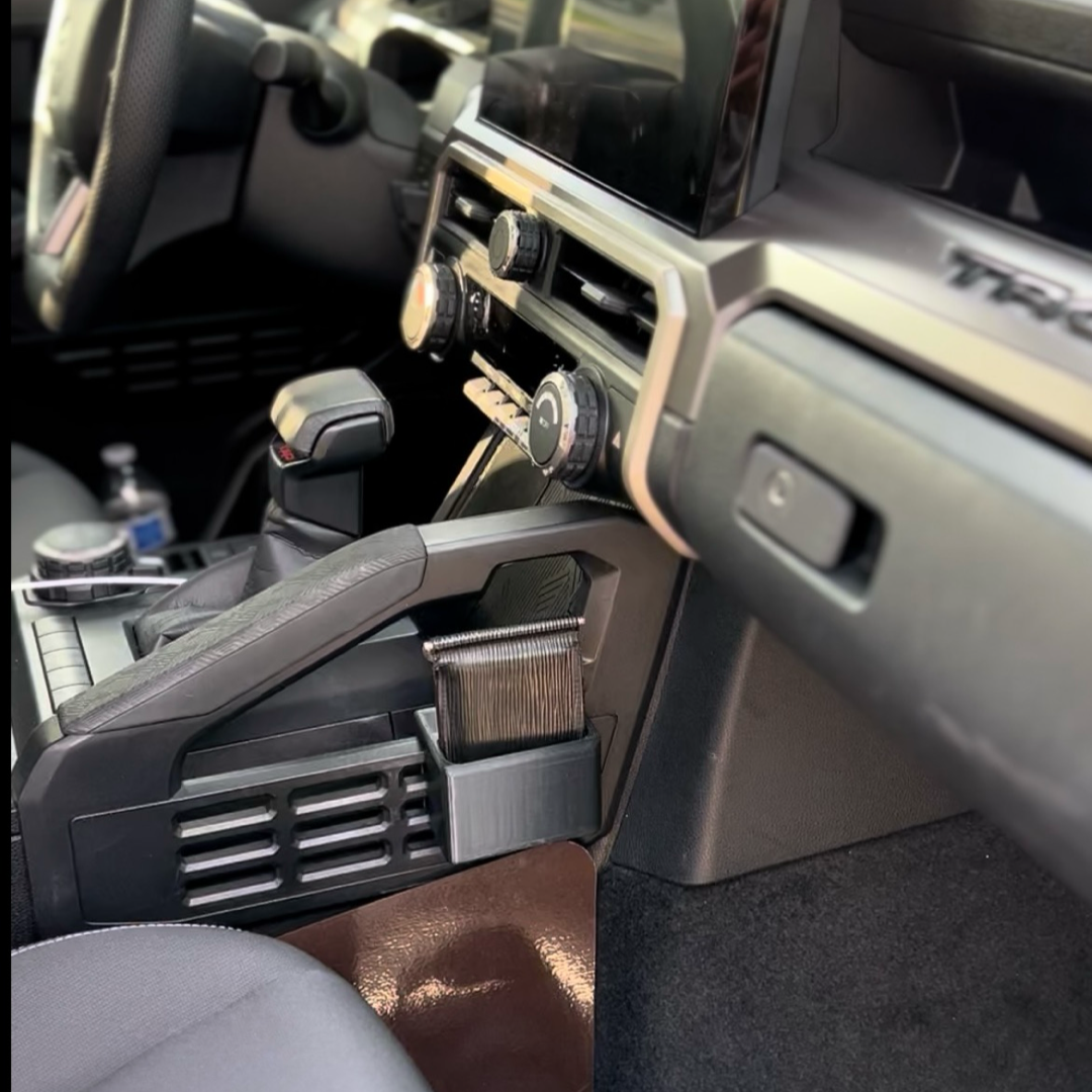 Drop-in center console storage cup installed in a 4th Gen Toyota Tacoma