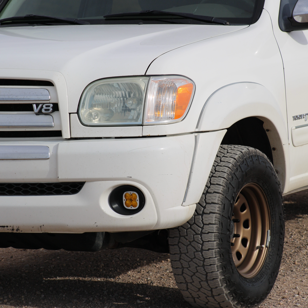 Baja Designs Squadron fog light installed in the front bumper of a lifted 1st Gen Toyota Tundra